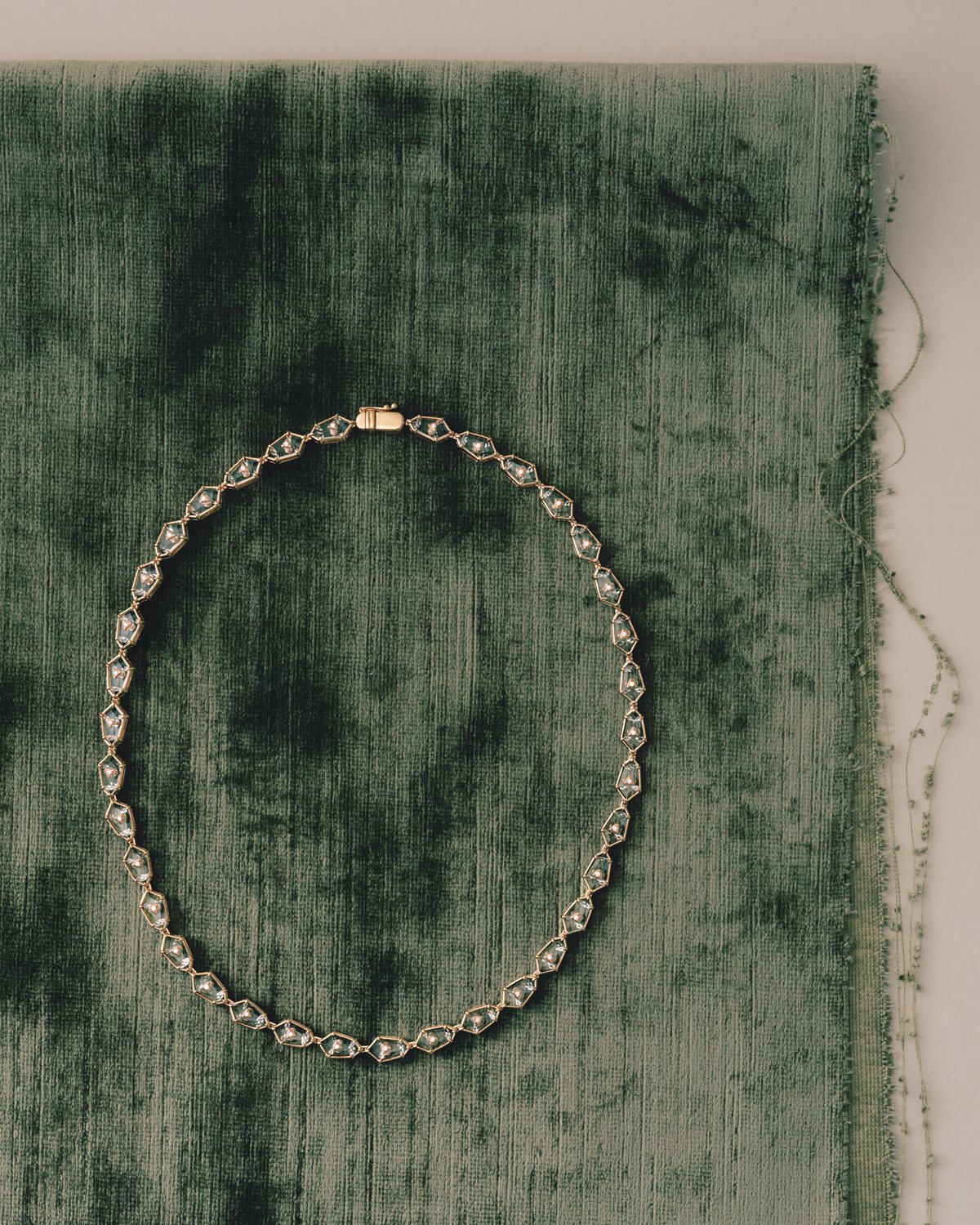 Crystal Prisme Charm Choker on crushed green velvet