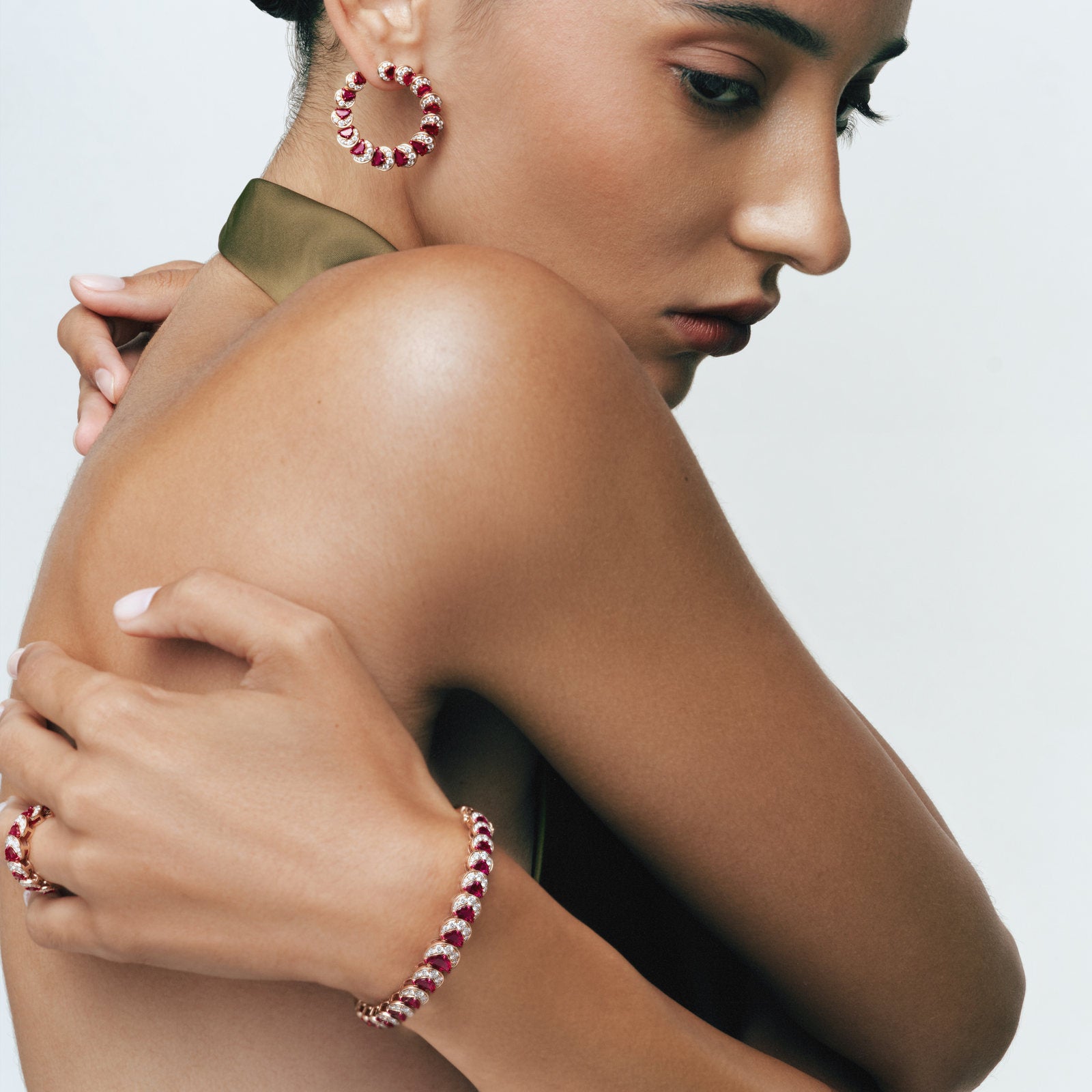 Model wearing the Ruby Crescent Bangle and Ruby Crescent Hoop Earrings