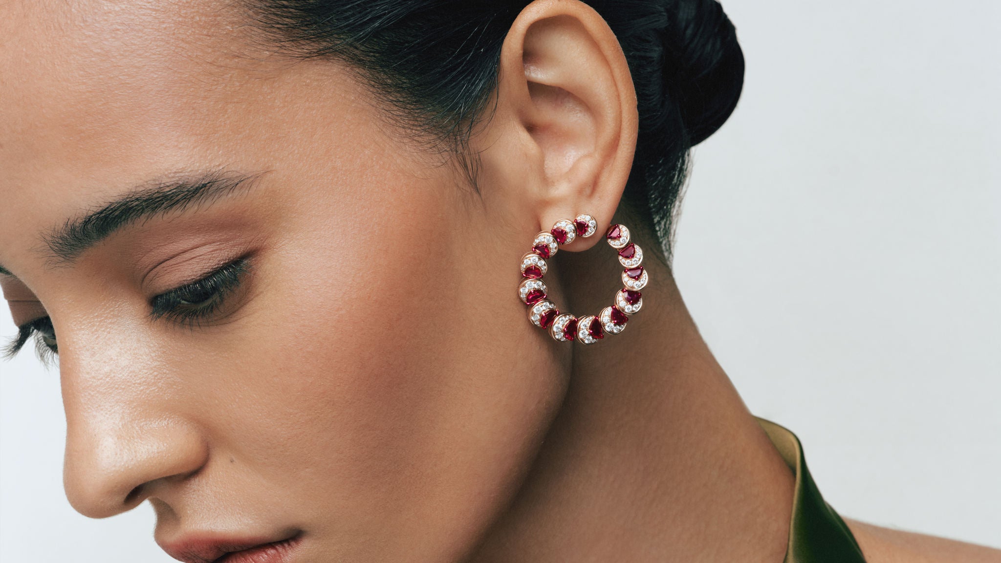 Model wearing the Ruby Crescent Hoop Earrings