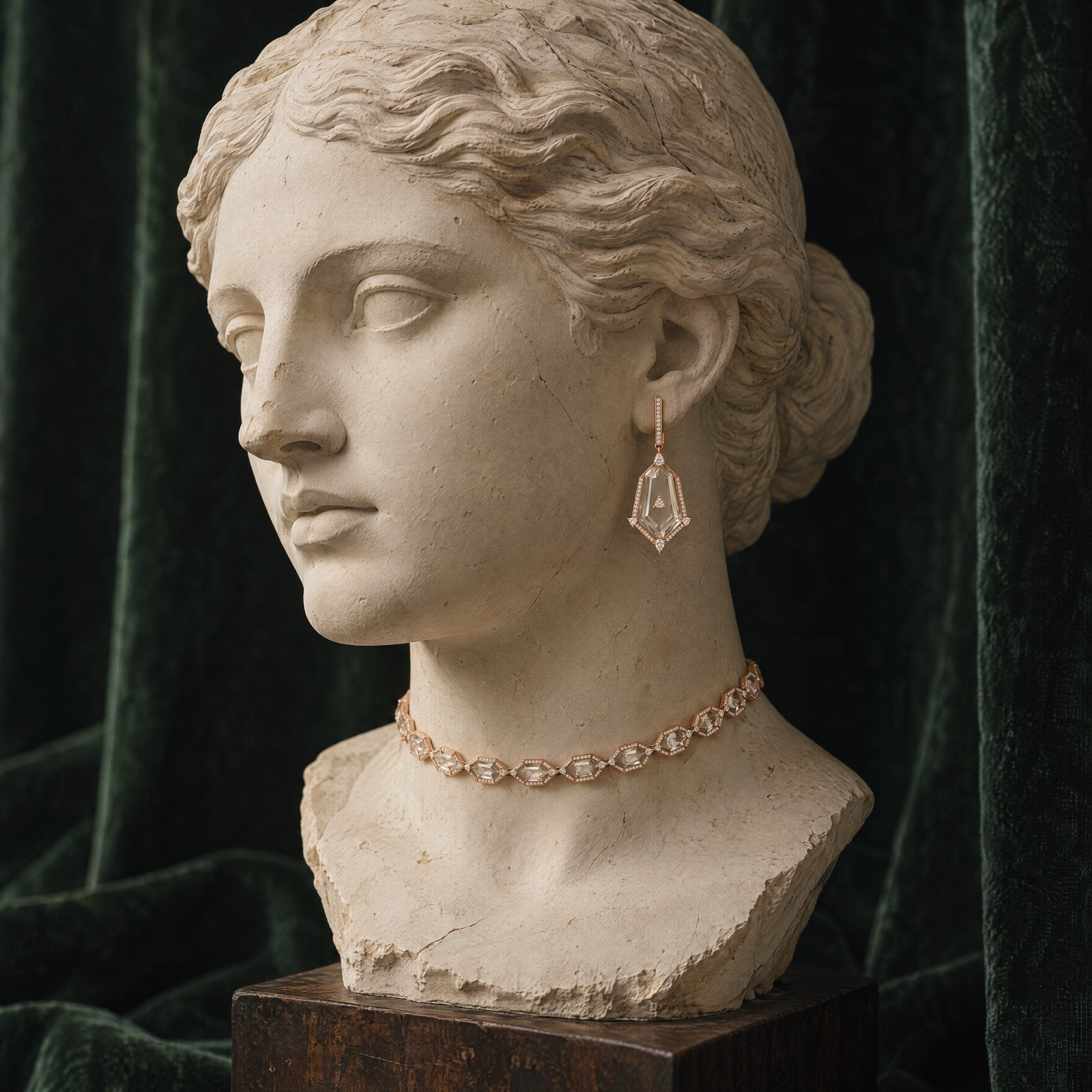 Plaster bust wearing the Crystal Prisme Statement Drop Earrings and Charm Choker