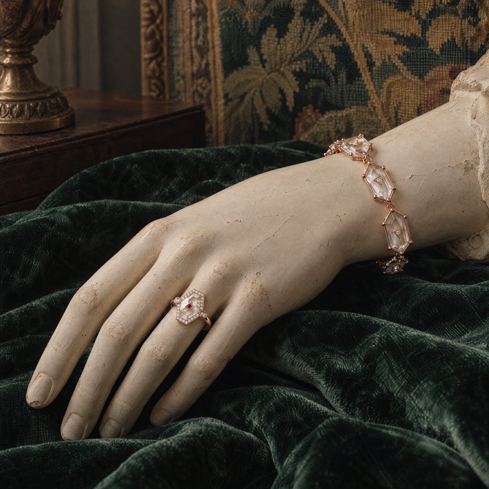 Plaster hand wearing the Crystal Prisme Statement Ring and Link Bracelet