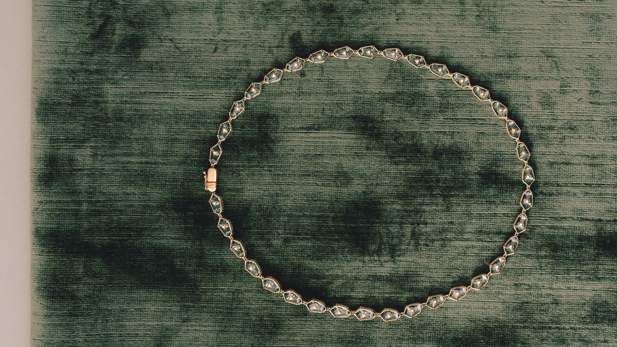 Crystal Prisme Charm Choker on green velvet