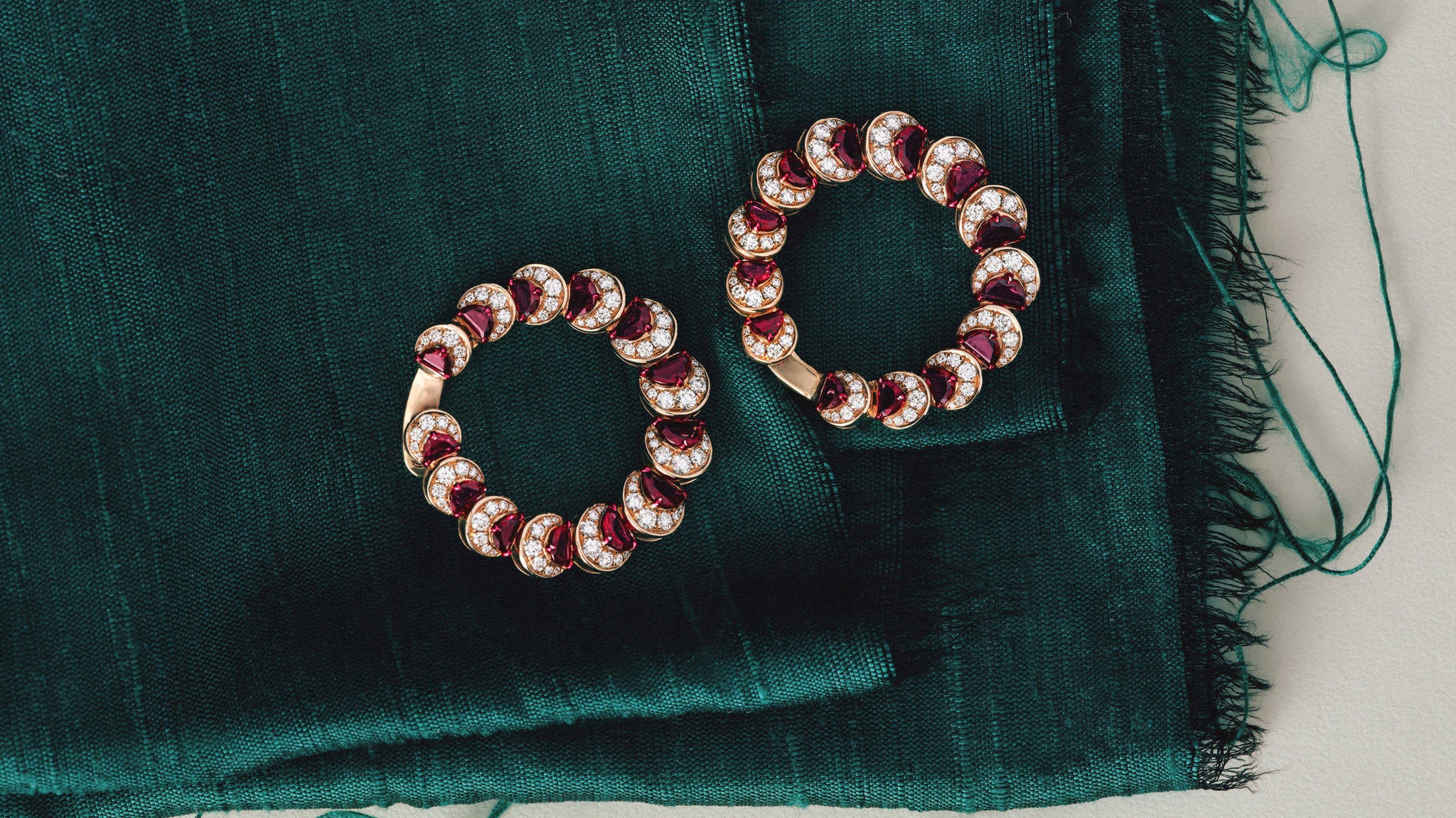 Ruby Crescent Hoop Earrings on green silk